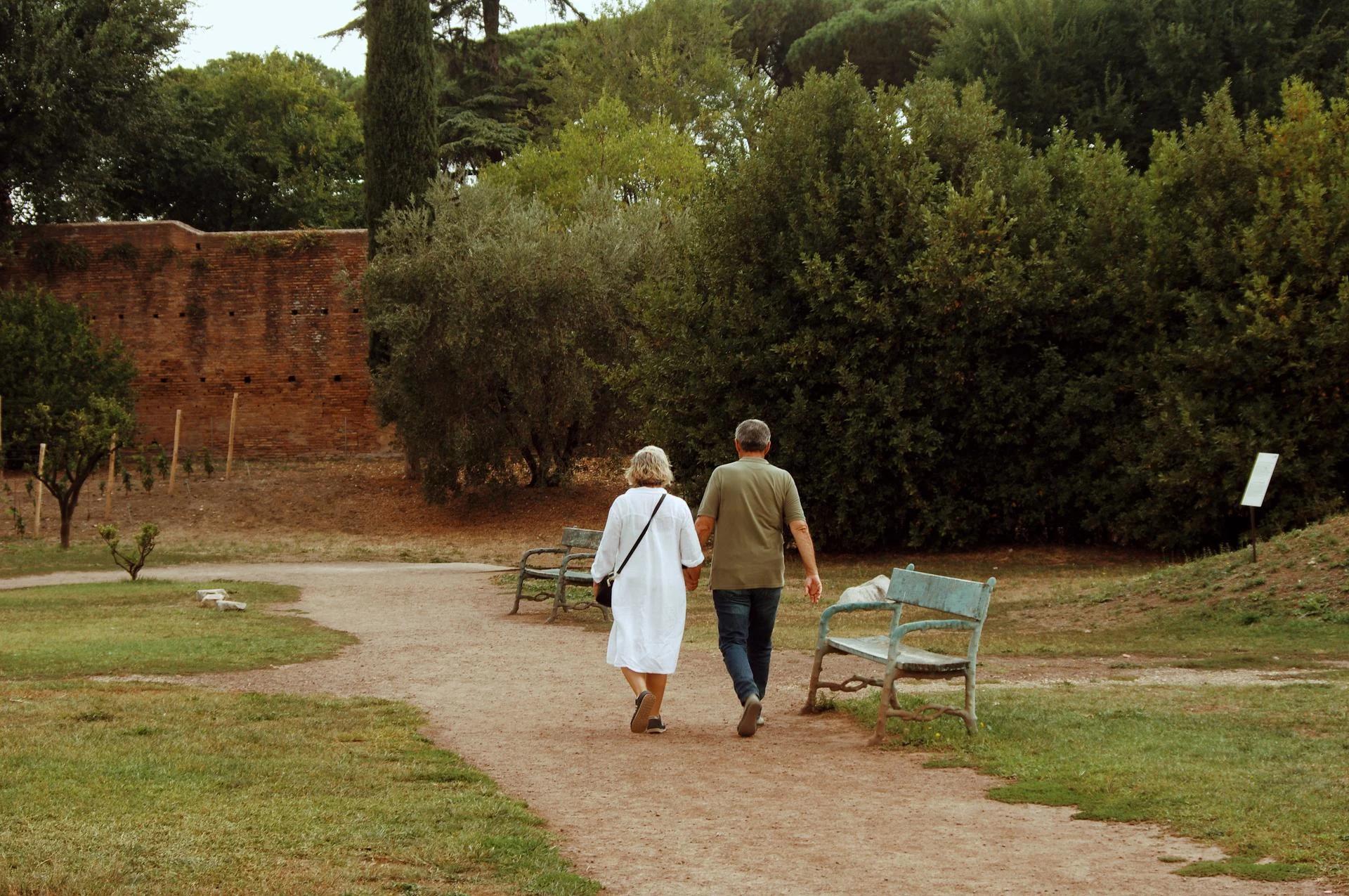 Old couple on a stroll in a park